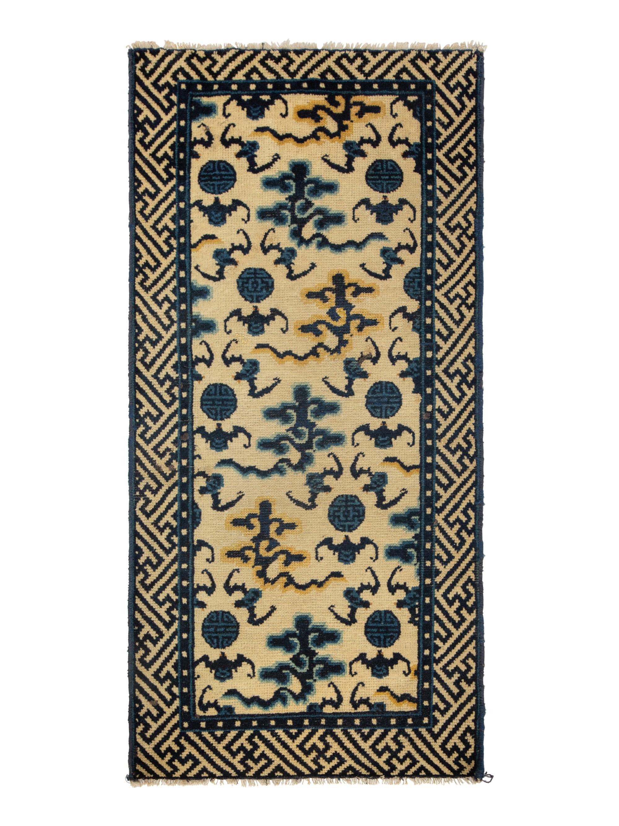 A Group of Four Chinese Rugs
