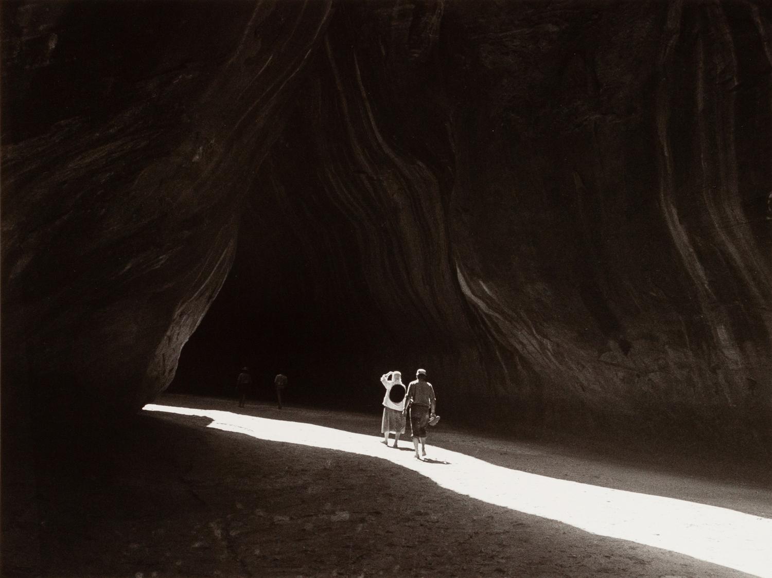 A group of four photographs ( O'Keeffe, Glen Canyon , 1961 (printed 1984); Georgia O'Keeffe Photographing the Chama River , 1961 (printed 1984); Untitled (O'Keeffe walking towards building) , 1960s; Untitled (O'Keeffe walking from building ), 1959 (printed 1984))