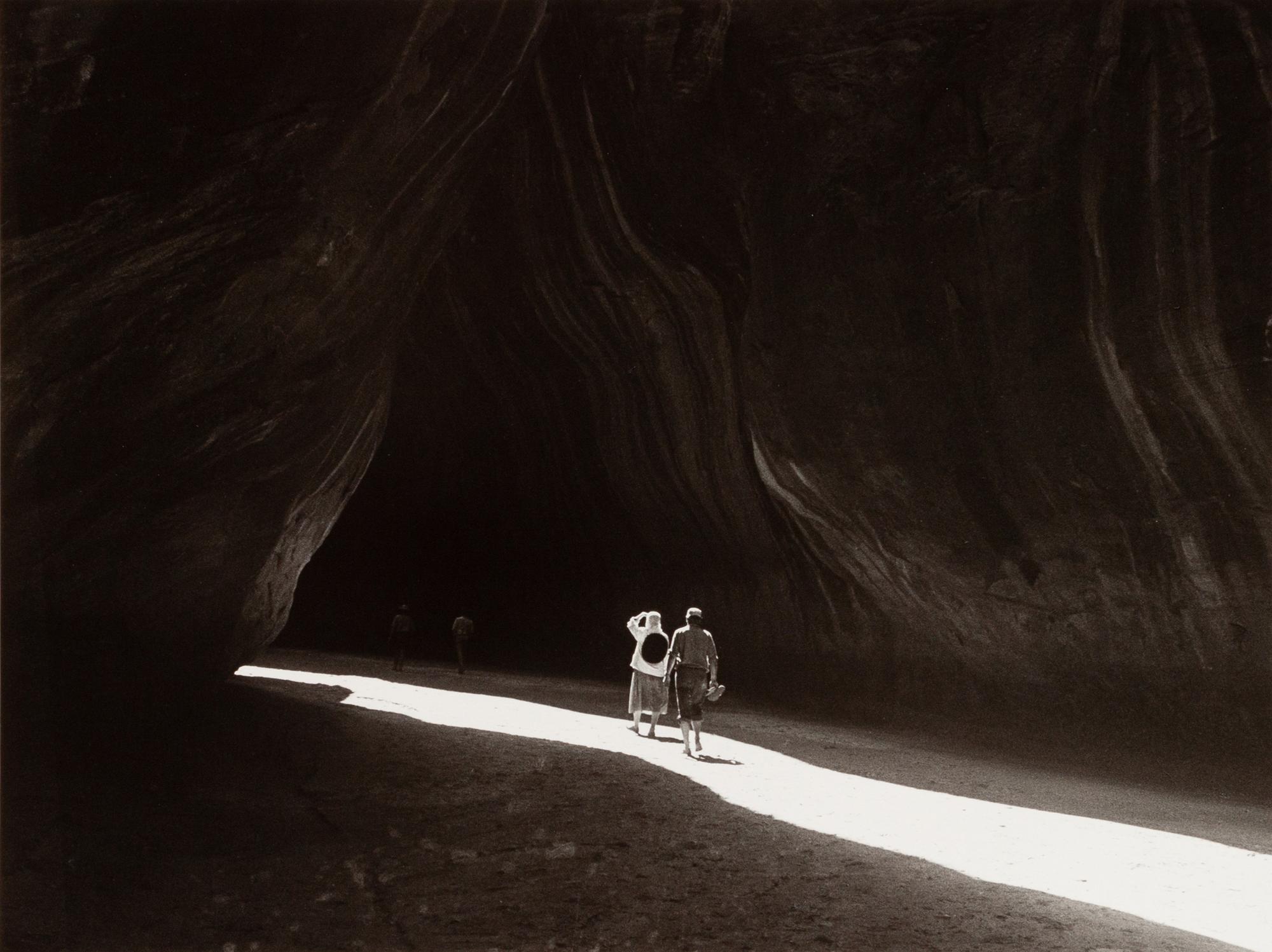A group of four photographs ( O'Keeffe, Glen Canyon , 1961 (printed 1984); Georgia O'Keeffe Photographing the Chama River , 1961 (printed 1984); Untitled (O'Keeffe walking towards building) , 1960s; Untitled (O'Keeffe walking from building ), 1959 (printed 1984))