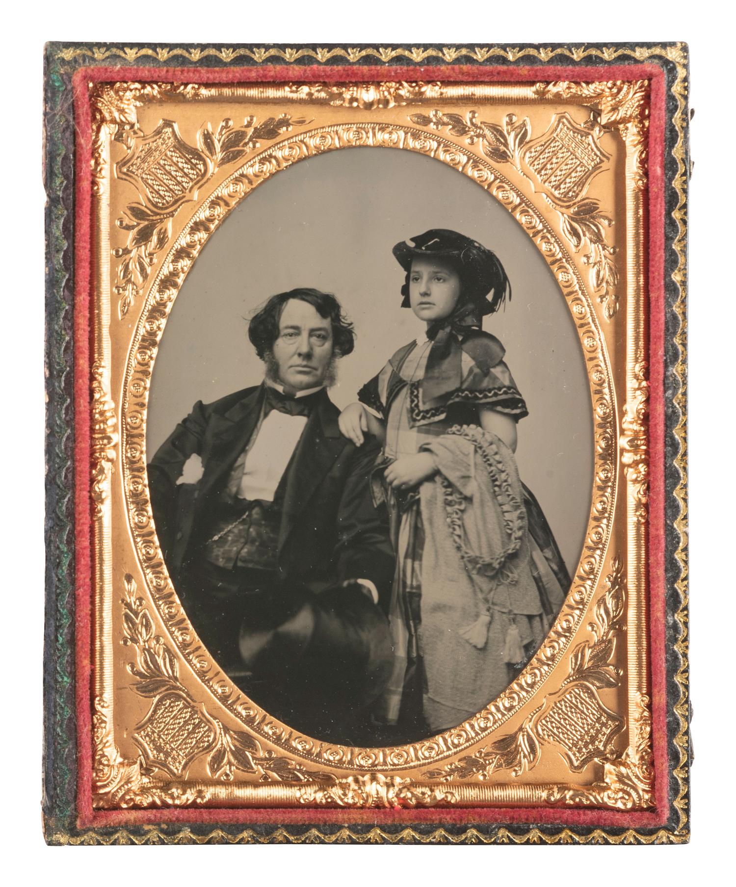 [EARLY PHOTOGRAPHY]. Quarter plate ruby ambrotype of an upper-class gentleman and his daughter.