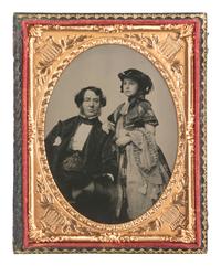[EARLY PHOTOGRAPHY]. Quarter plate ruby ambrotype of an upper-class gentleman and his daughter.