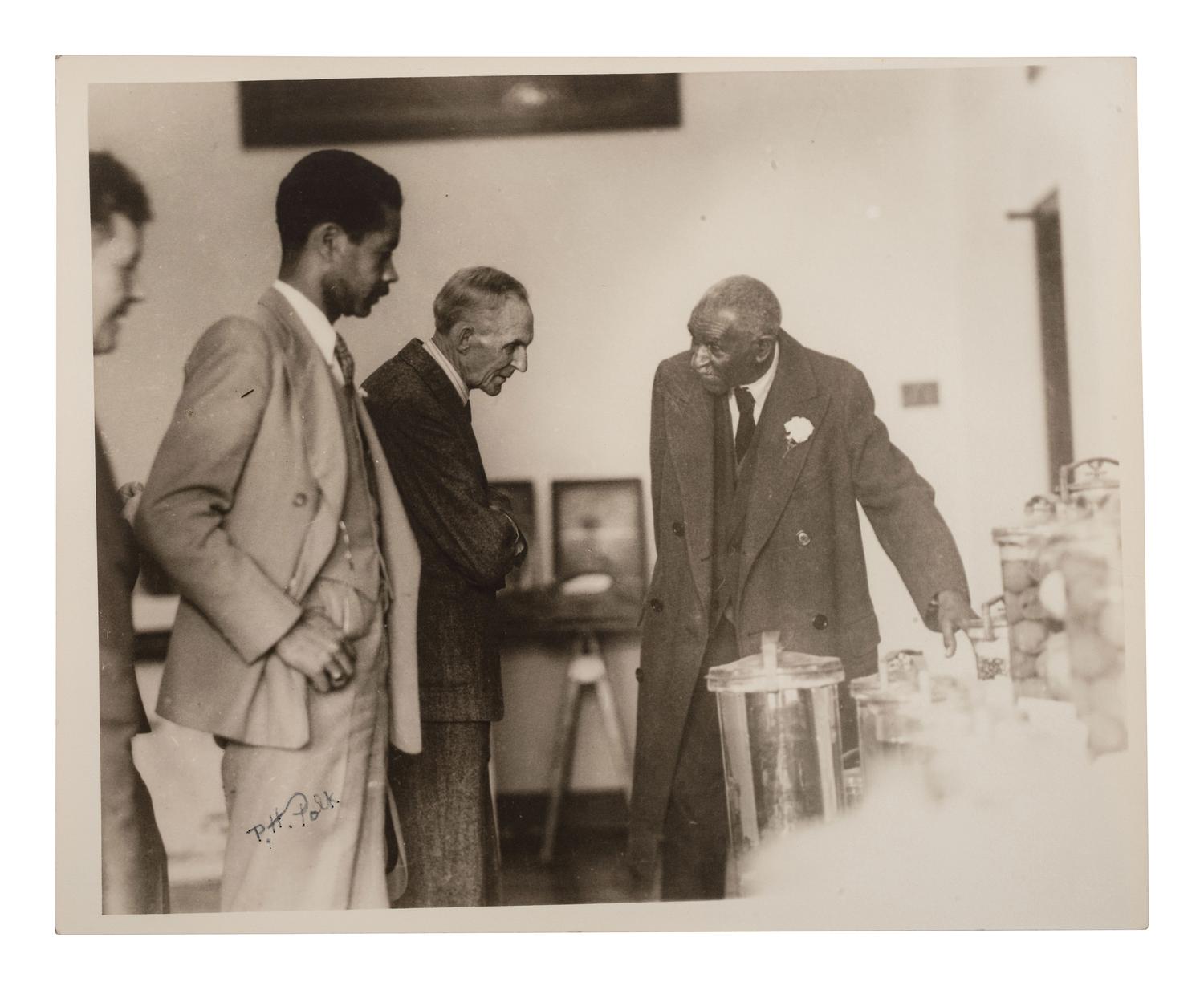 CARVER, George Washington (ca 1864-1943). Two TLsS ("G.W. Carver"), April and October 1936.[ With: ] POLK, Prentice H. (1898-1984), photographer. Photograph of George Washington Carver and Henry Ford, signed ("P.H. Polk"), ca 1920s.