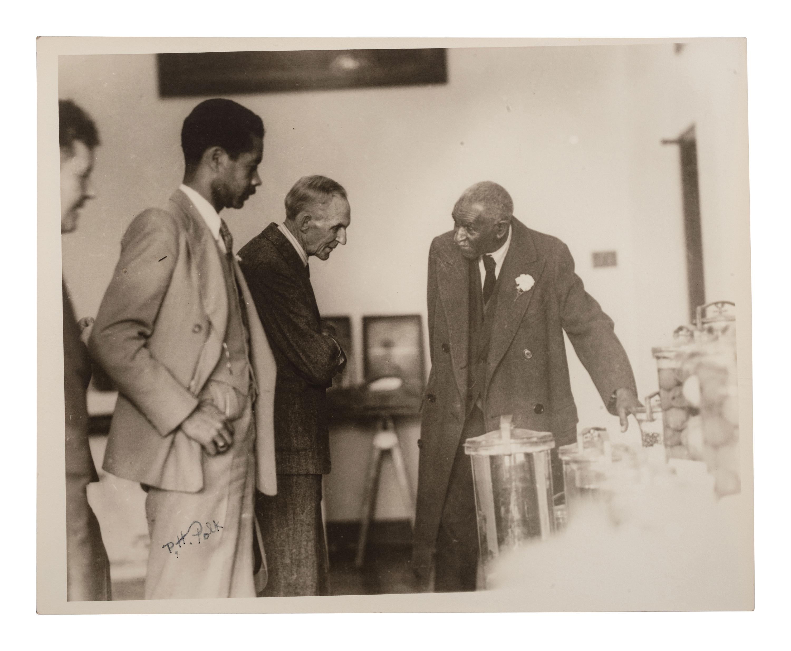 CARVER, George Washington (ca 1864-1943). Two TLsS ("G.W. Carver"), April and October 1936.[ With: ] POLK, Prentice H. (1898-1984), photographer. Photograph of George Washington Carver and Henry Ford, signed ("P.H. Polk"), ca 1920s.