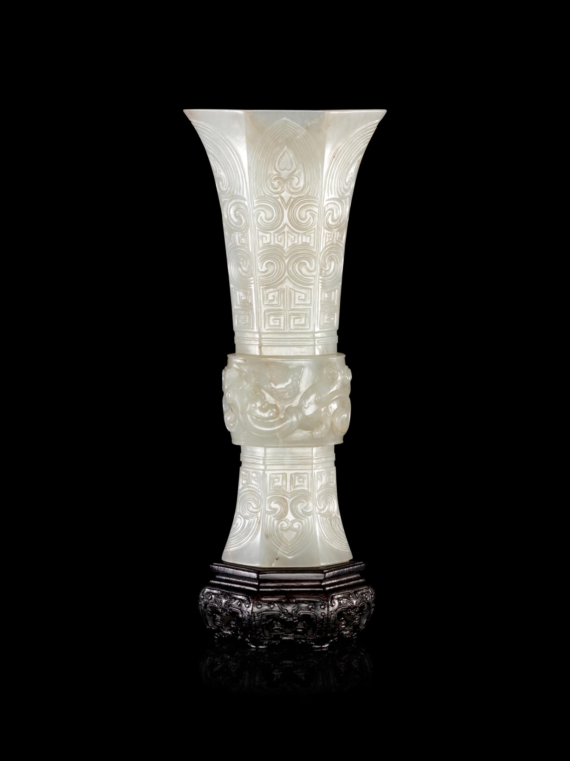 A Carved White Jade Gu Vase