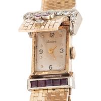 GENOVA, 14K YELLOW GOLD SURPRISE WATCH WITH RUBIES AND DIAMONDS