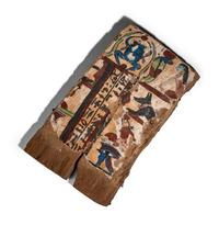 An Egyptian Painted Wood Sarcophagus Fragment with a Scarab