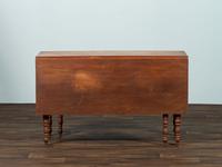A Late Federal Cherrywood Drop-Leaf Dining Table