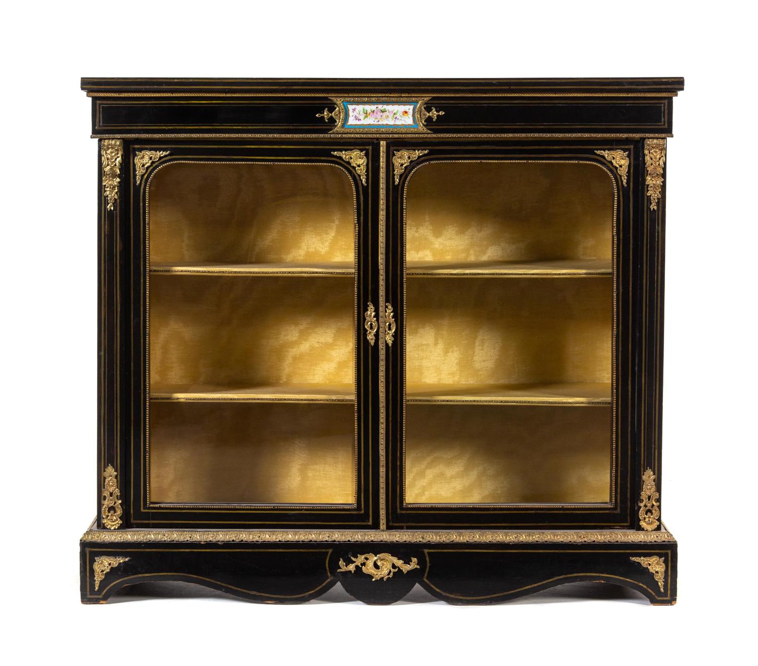 A Napoleon III Gilt Bronze Mounted and Porcelain Inset Ebonized Vitrine Cabinet