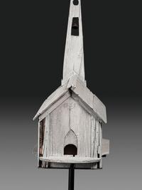 A Carved Wood Church Form Bird House on Stand