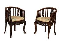 A Pair of Chinese Hongmu Horseshoe Back Carved Armchairs