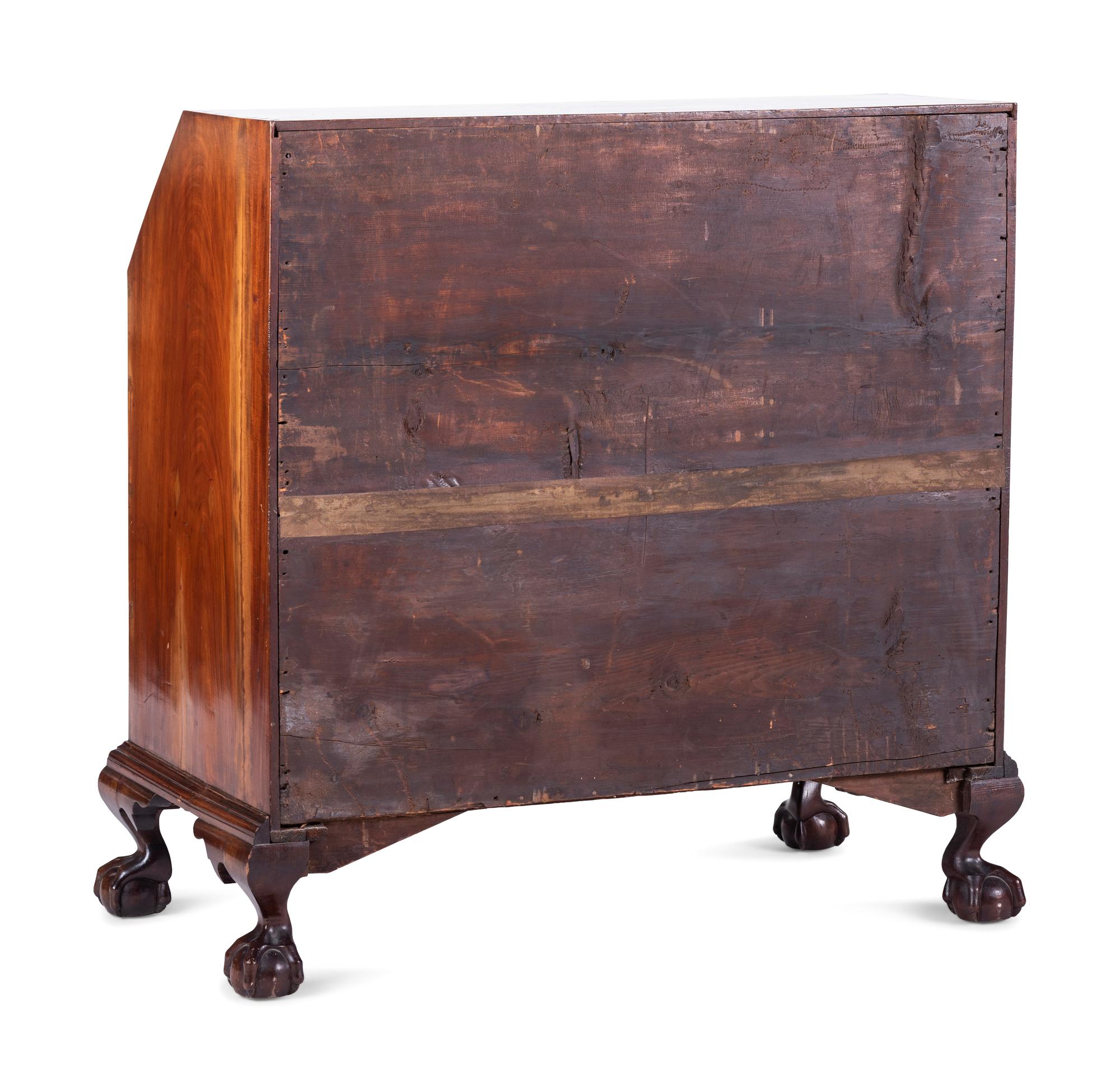 A Chippendale Carved and Figured Mahogany Block-Front Slant-Front Desk
