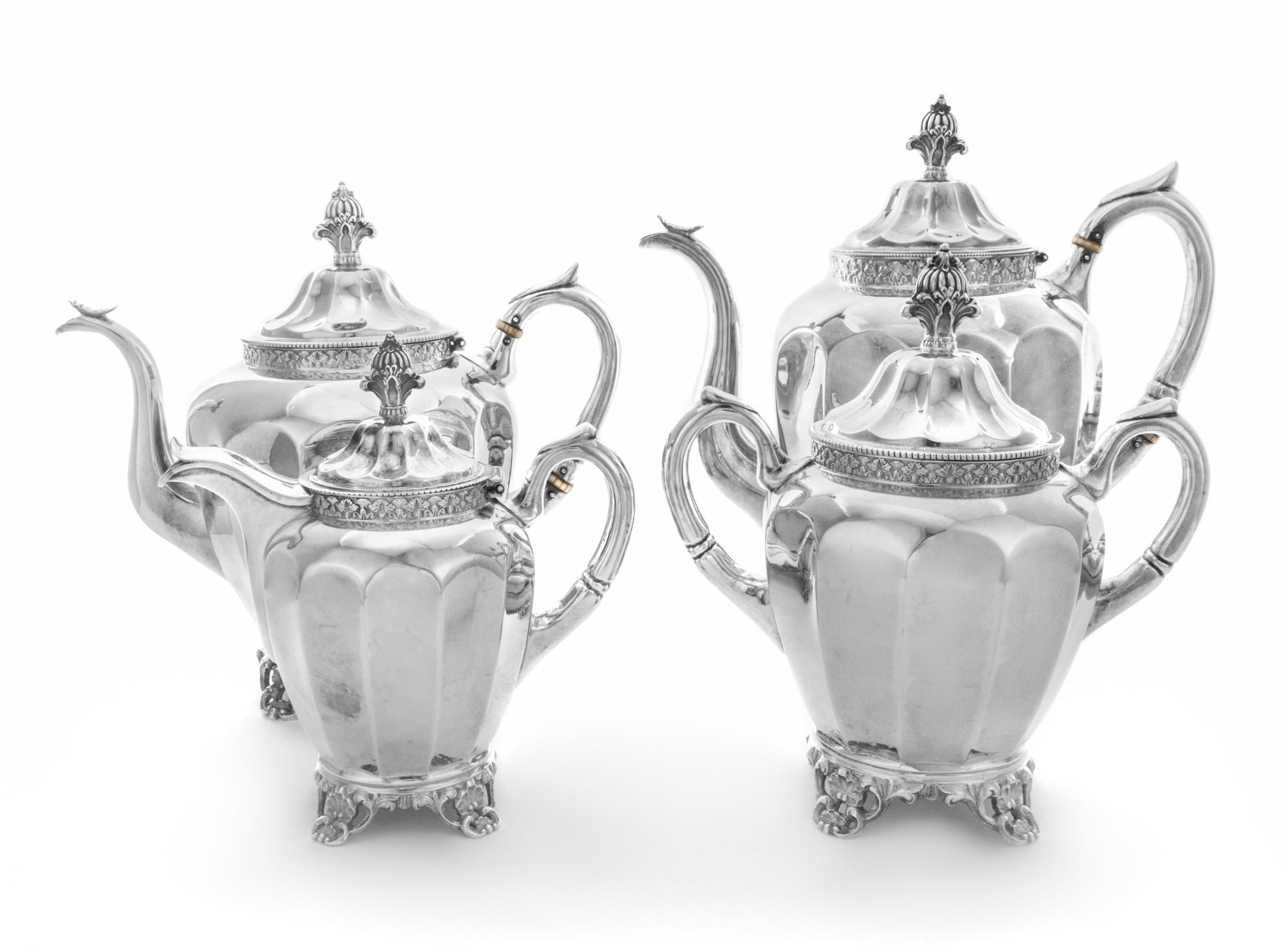 An American Coin Silver Four-Piece Tea and Coffee Service, Wood & Hughes, New York, NY, 19th Century, comprising a teapot, coffee pot,