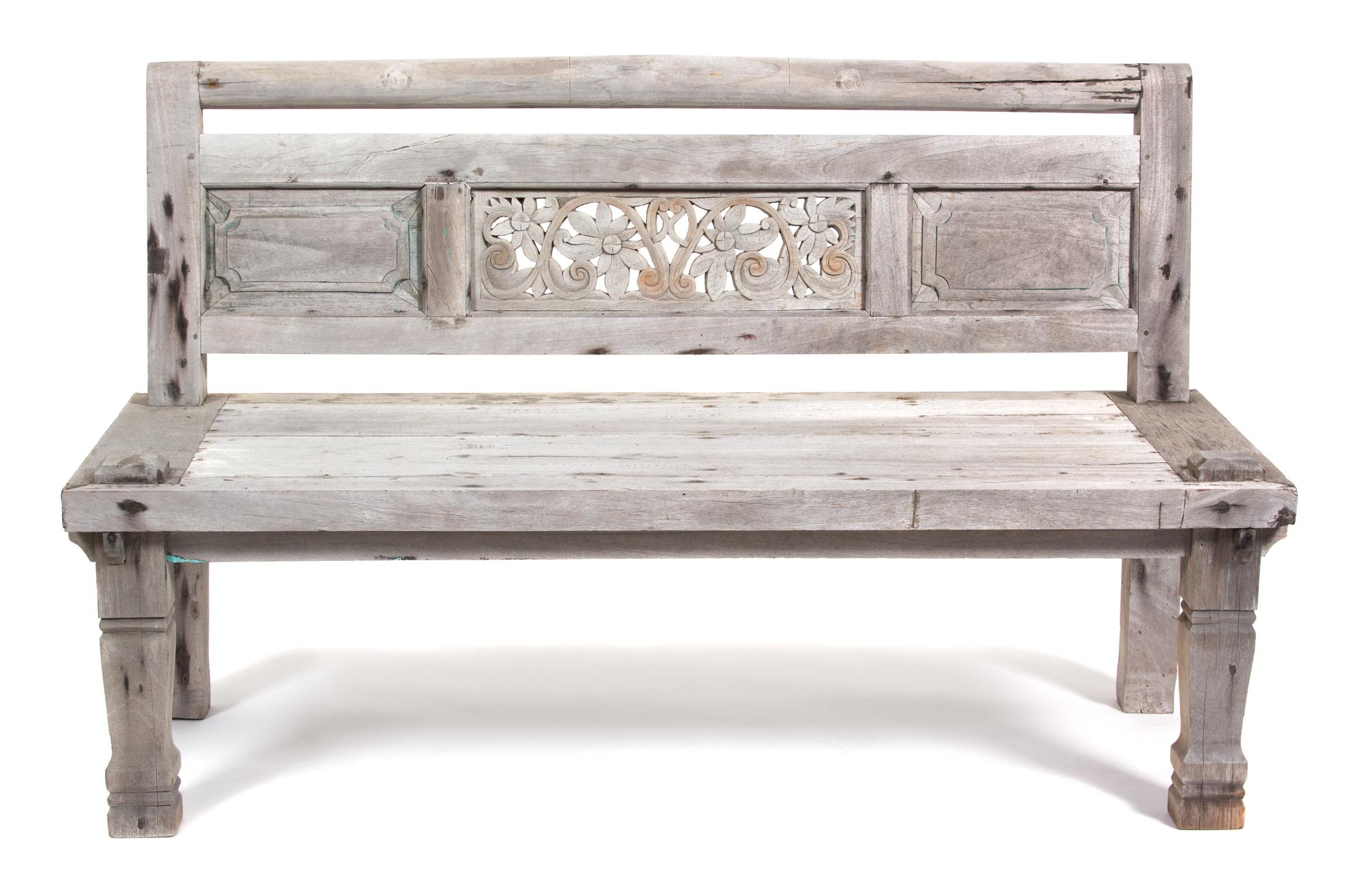A South East Asian Carved Weathered Teak Bench Height 36 x width 59 1/4 x depth 26 1/4 inches. — 20TH CENTURY
