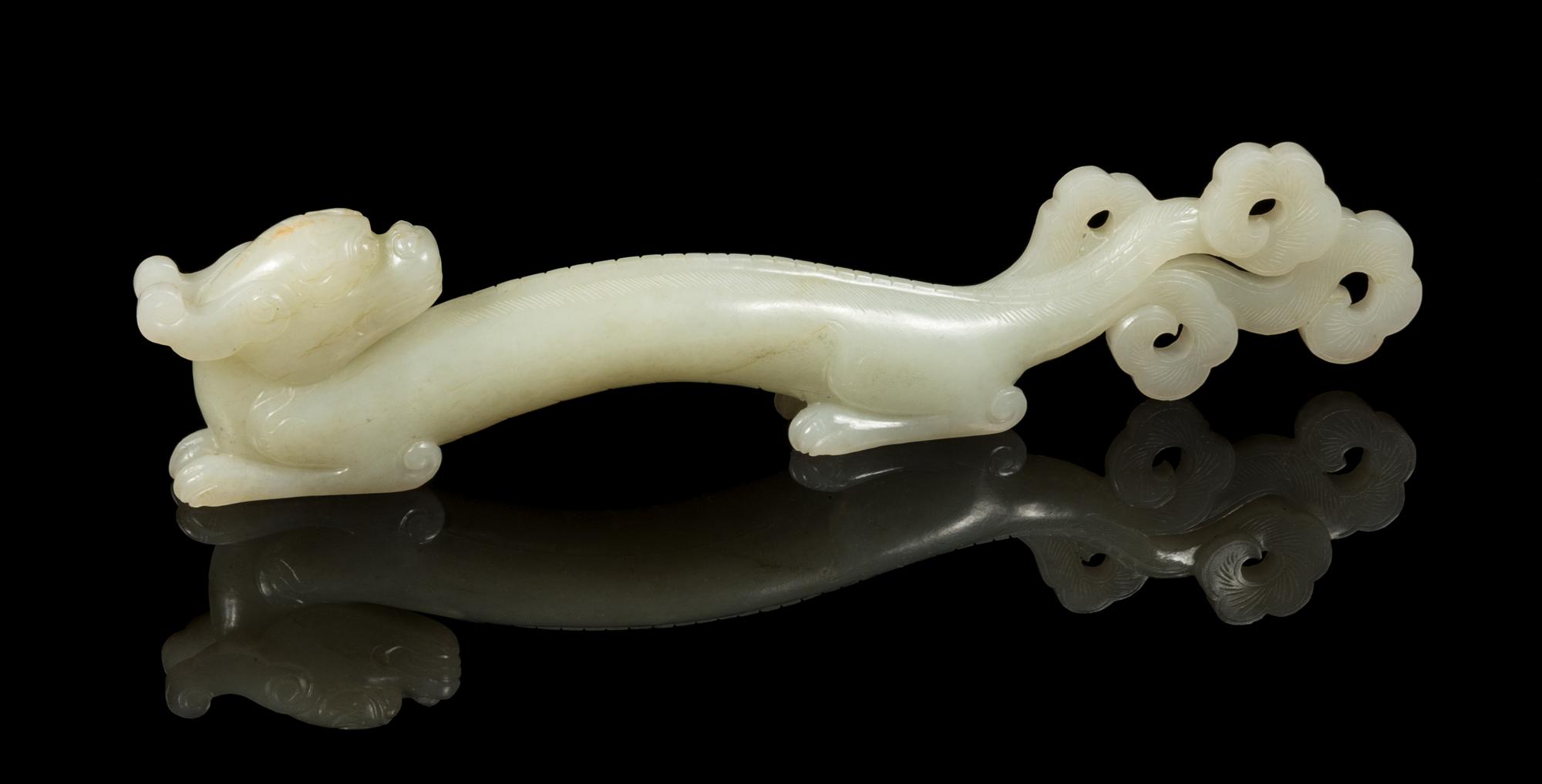 A Pale Celadon Jade Chilong Paper Weight Length 8 inches. — 18TH/19TH CENTURY
