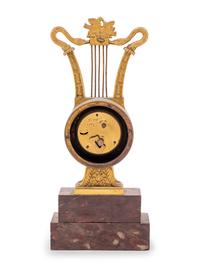 An Empire Style Gilt Bronze and Rouge Marble Clock