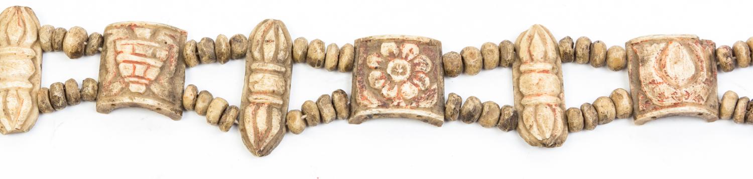 A String of Tibetan Carved Bone Beads Length 20 inches.