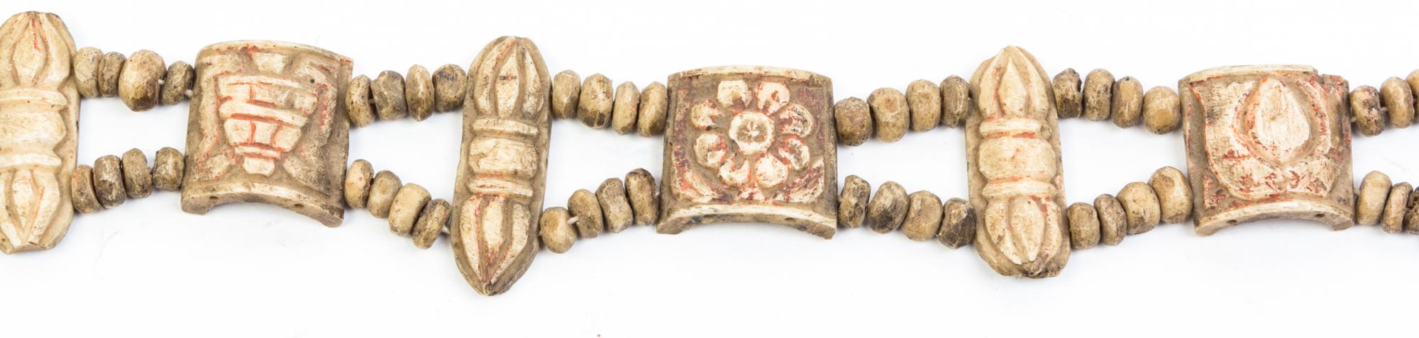 A String of Tibetan Carved Bone Beads Length 20 inches.
