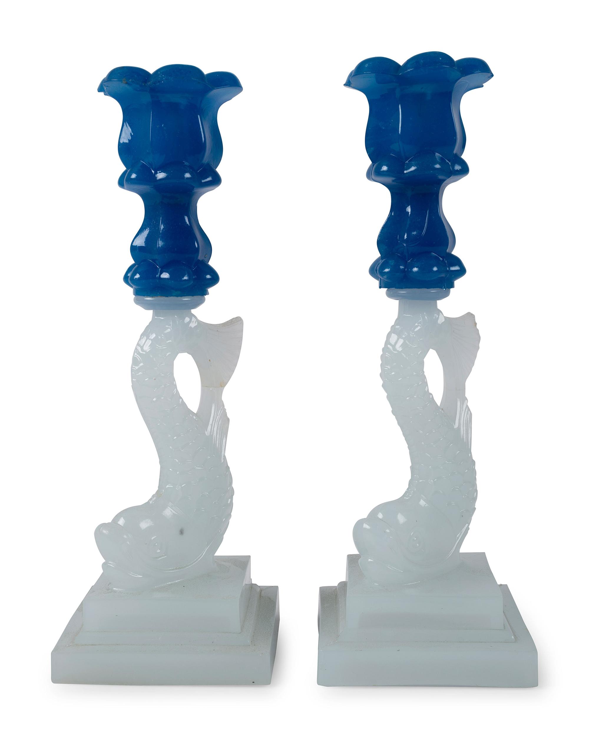 A Pair of Sandwich Glass Dolphin Candlesticks