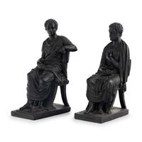 A Pair of Black Earthenware or Composition Figures