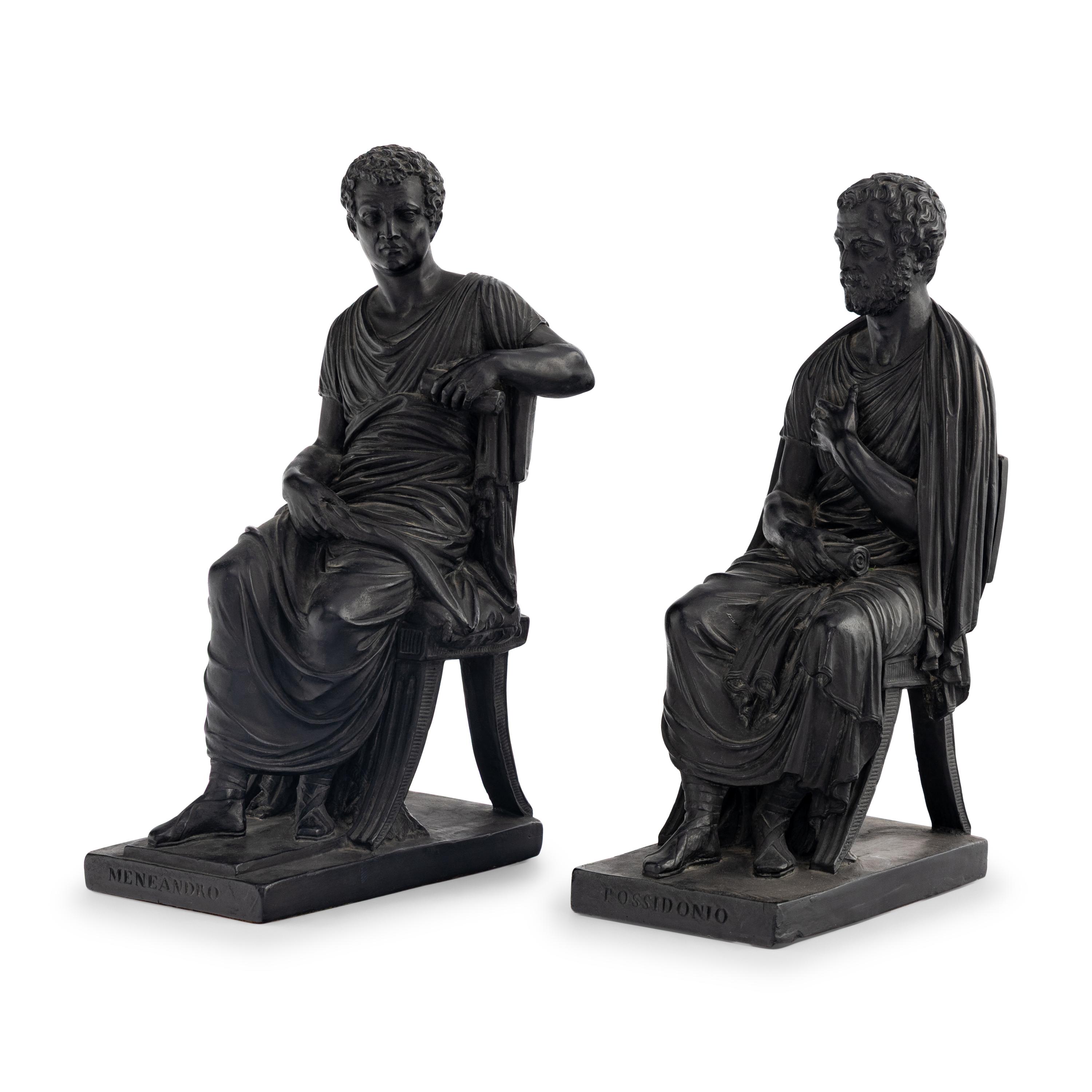 A Pair of Black Earthenware or Composition Figures