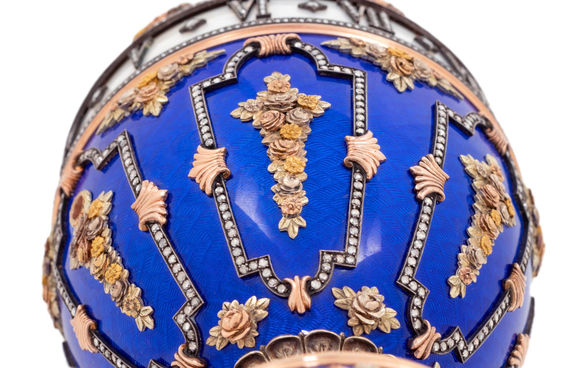 A Gold, Enamel and Diamond Inset Egg-Form Annular Clock