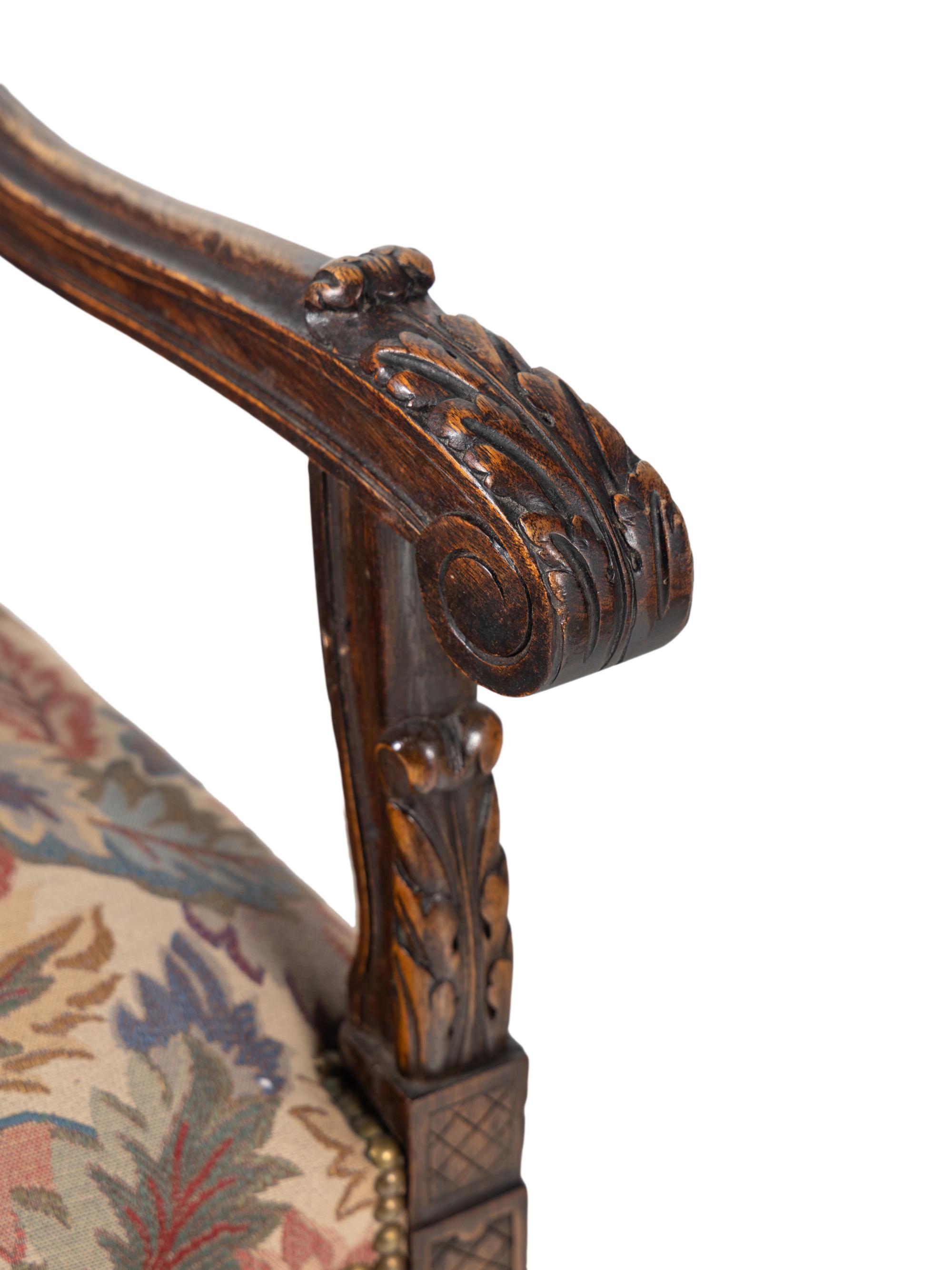 A Set of Eight Renaissance Style Carved Walnut Dining Chairs