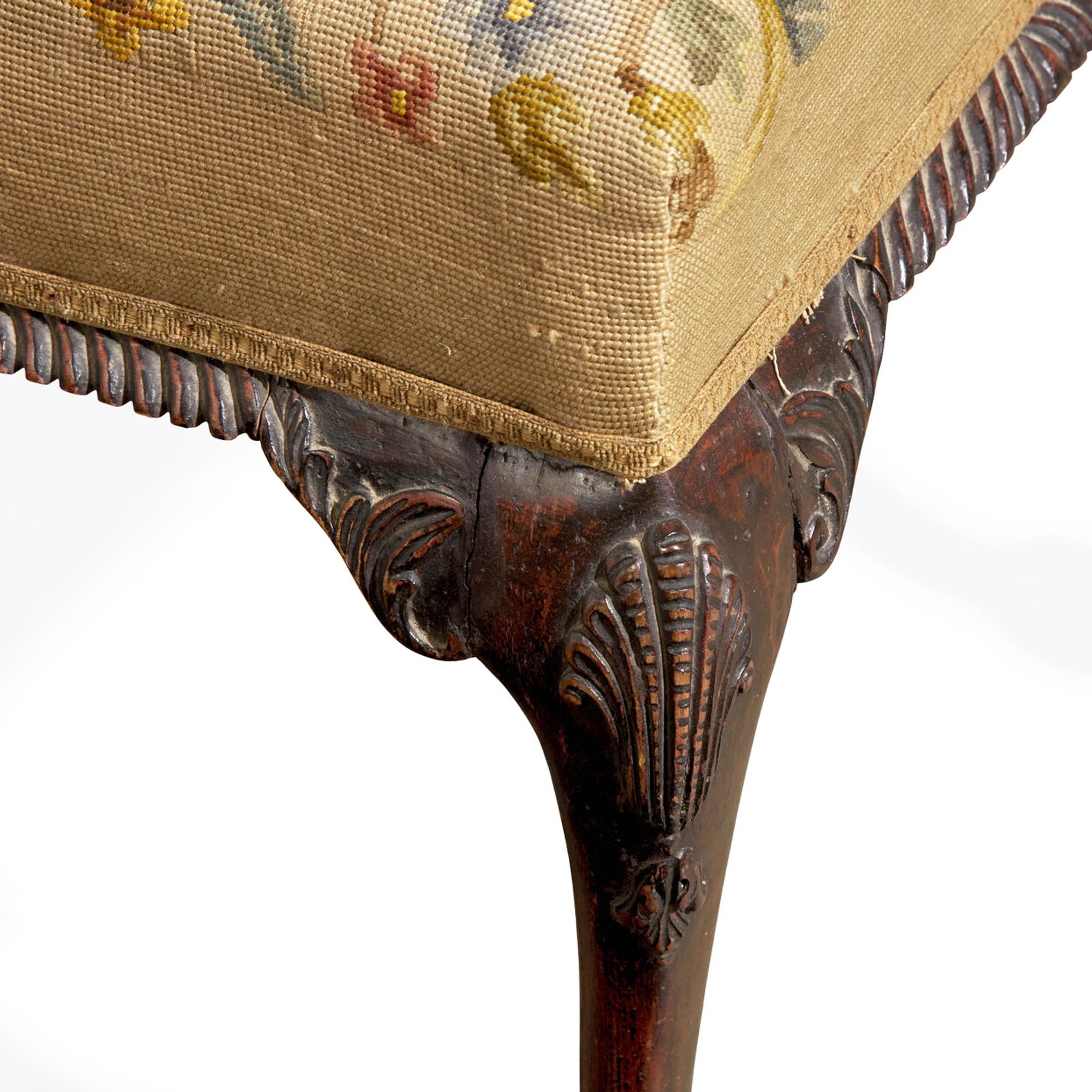 A George III Style Carved Mahogany Stool with Needlepoint Upholstery