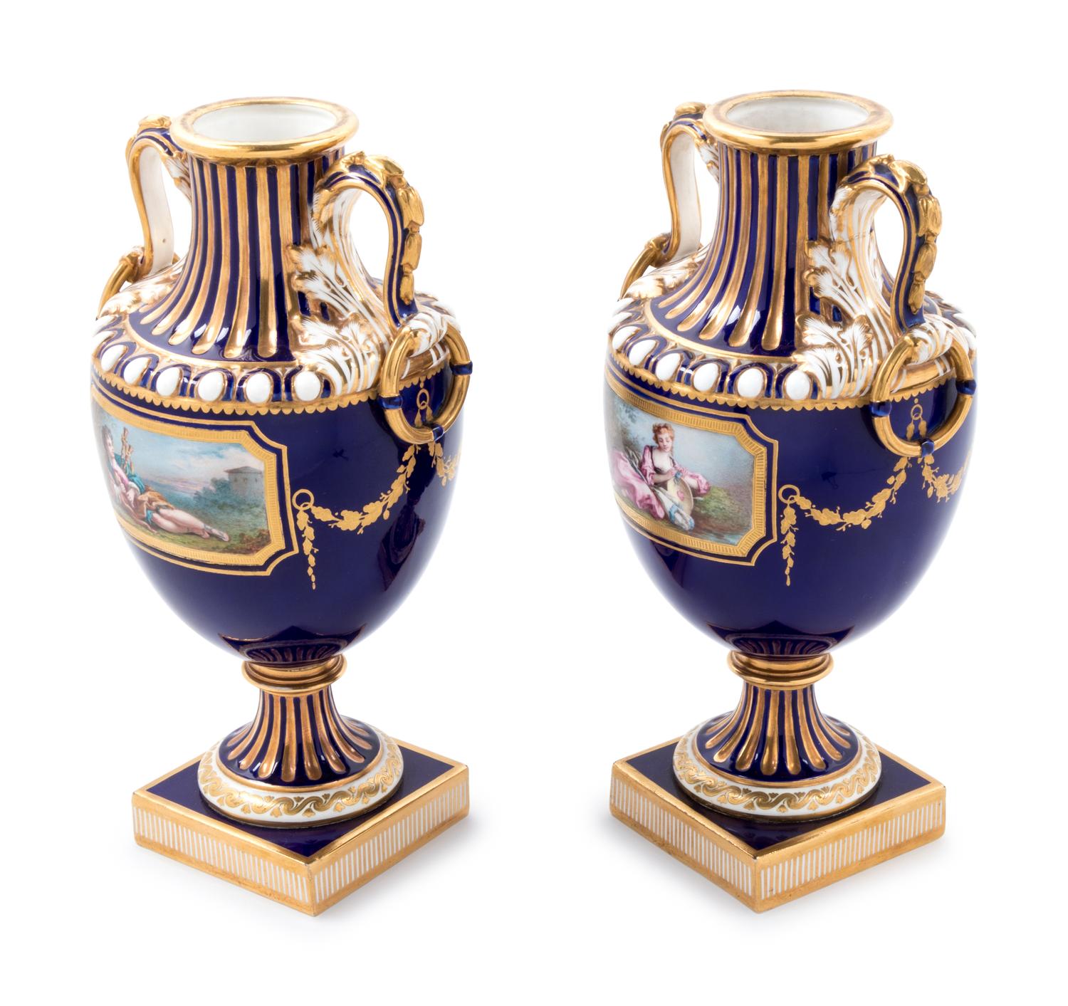 A Pair of Minton Painted and Parcel Gilt Porcelain Urns