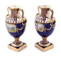 A Pair of Minton Painted and Parcel Gilt Porcelain Urns