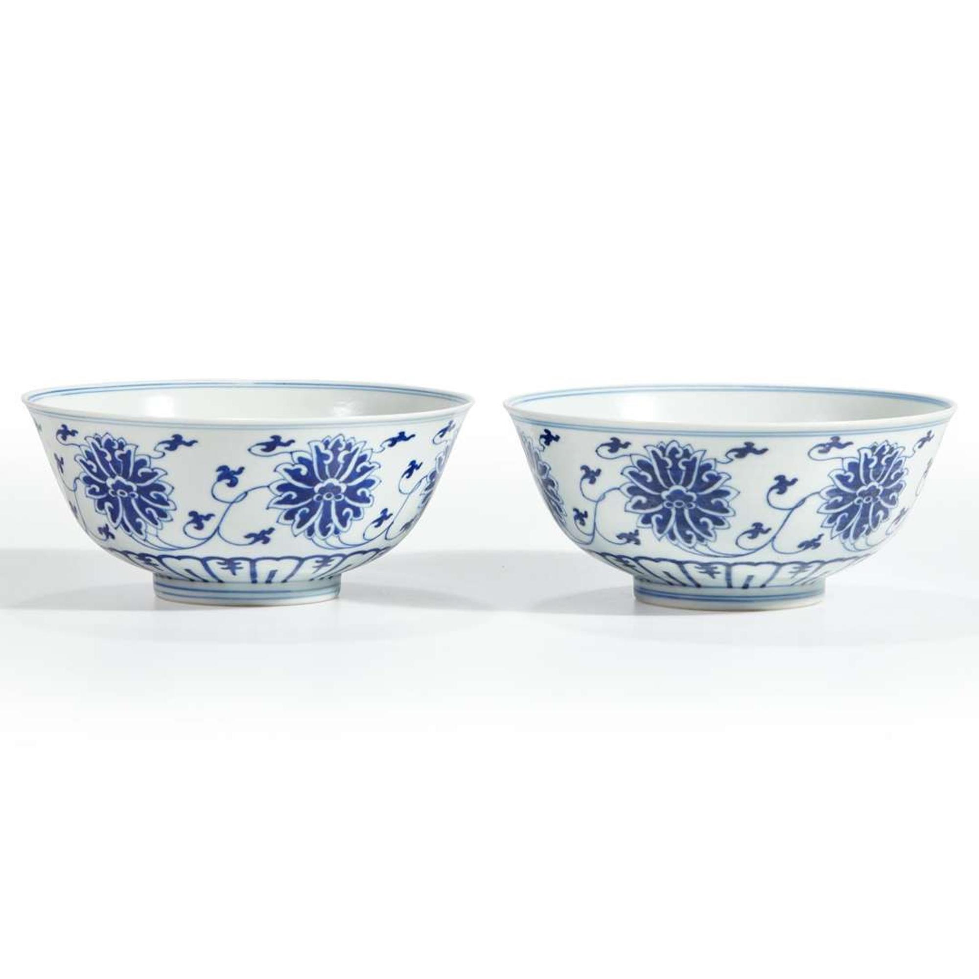 An associated pair of Chinese blue and white porcelain "Lotus" bowls Guangxu six-character marks