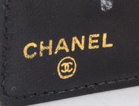 A Chanel Black Caviar Leather Wallet, 7" x 4" x .5".