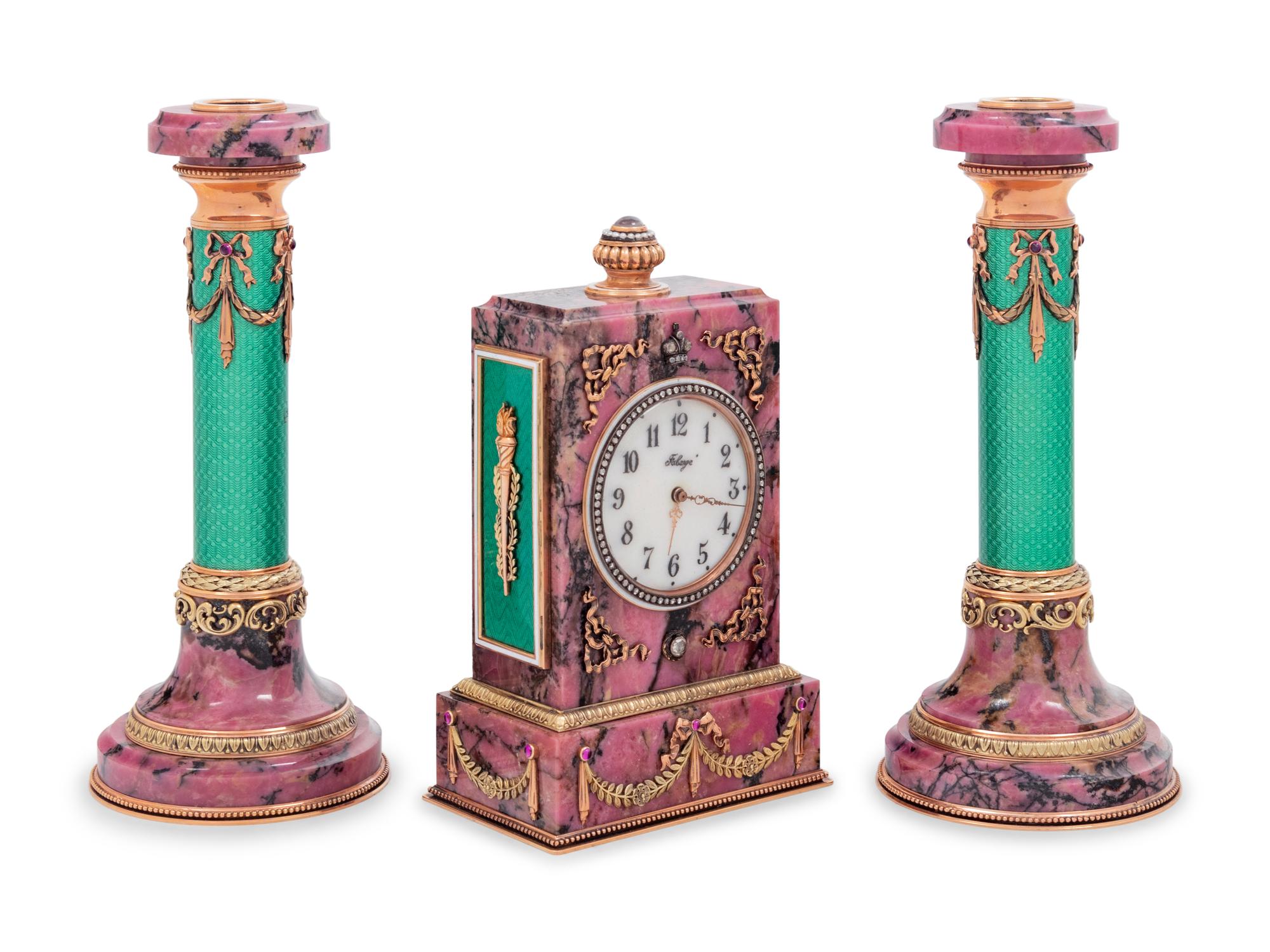 A Carved Hardstone, Enamel, 14-Karat Gold and Hardstone Mounted Three-Piece Clock Garniture