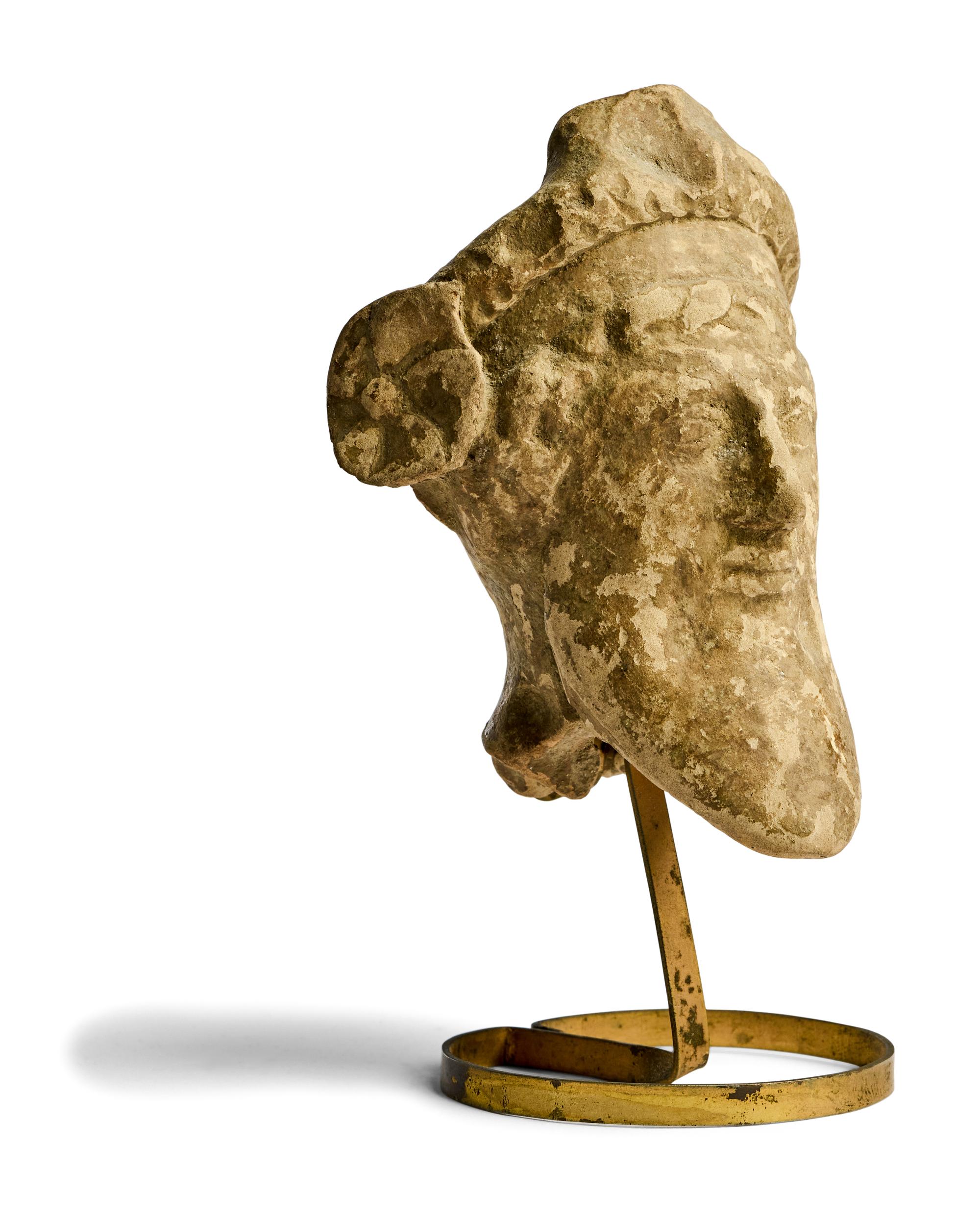 A Greek Terracotta Head of a Satyr