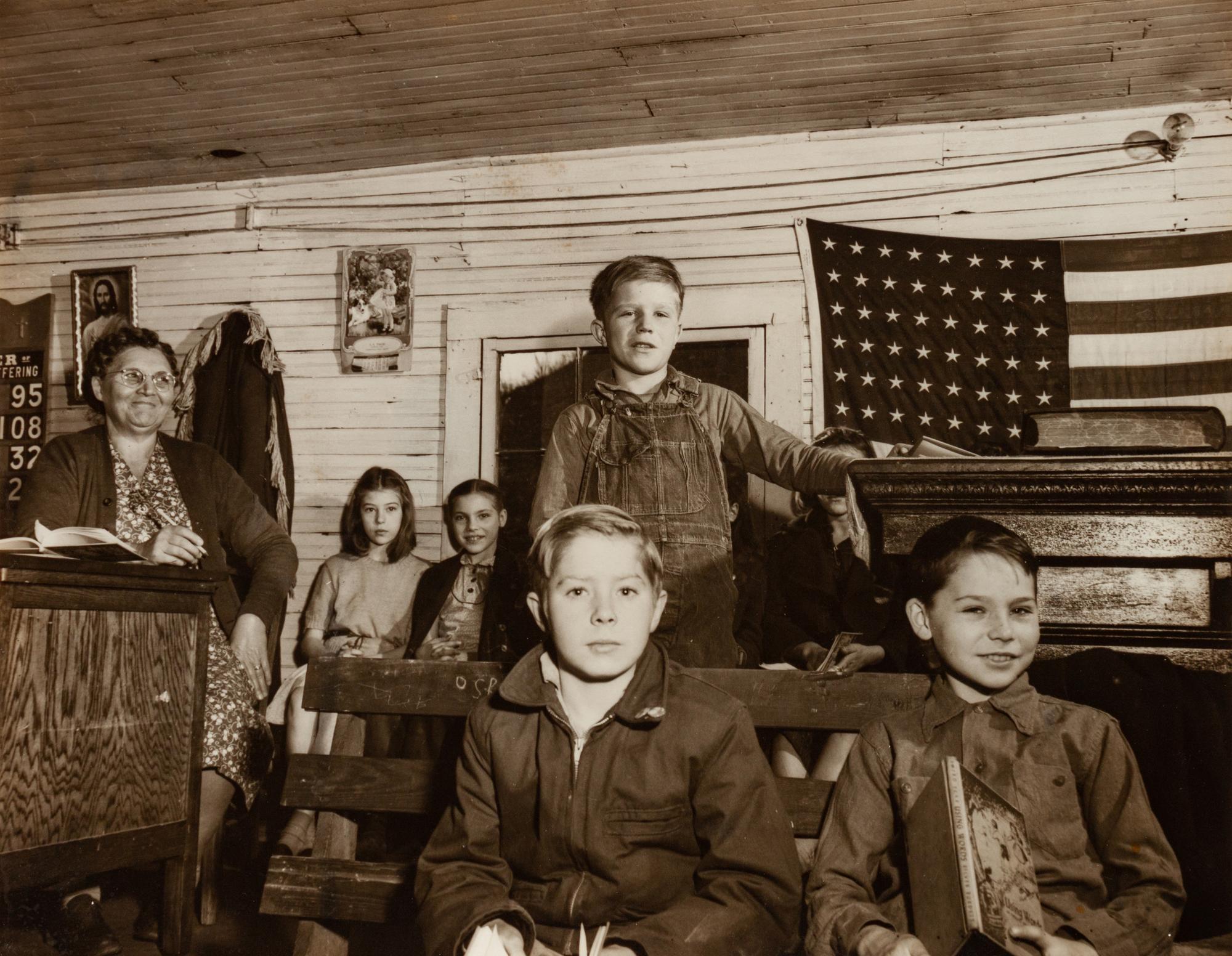 A group of four photographs ( Untitled (sleeping child) , 1950; TWU Rally Downtown , 1947; Three Forks, West Virginia, Mine School (with flag) , 1948; Mine Town School, Three Forks West Virginia (boy walking through gate) , 1948)