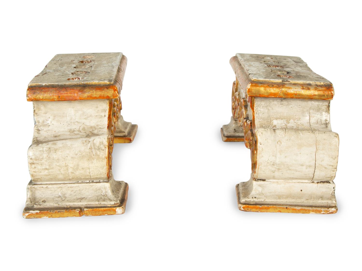 A Pair of Continental Painted and Parcel Gilt Candelabra
