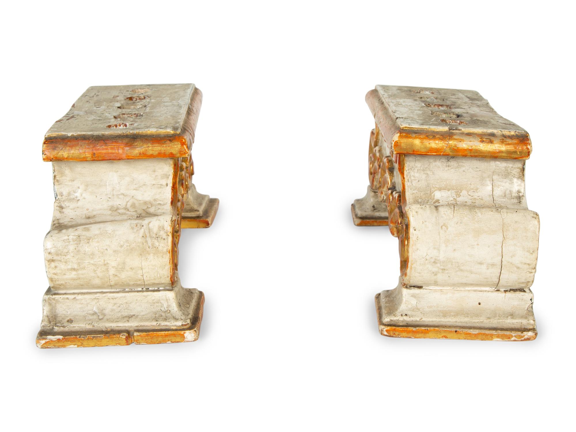 A Pair of Continental Painted and Parcel Gilt Candelabra