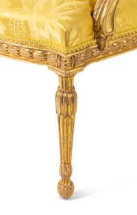 A Pair of George III Carved Giltwood Armchairs