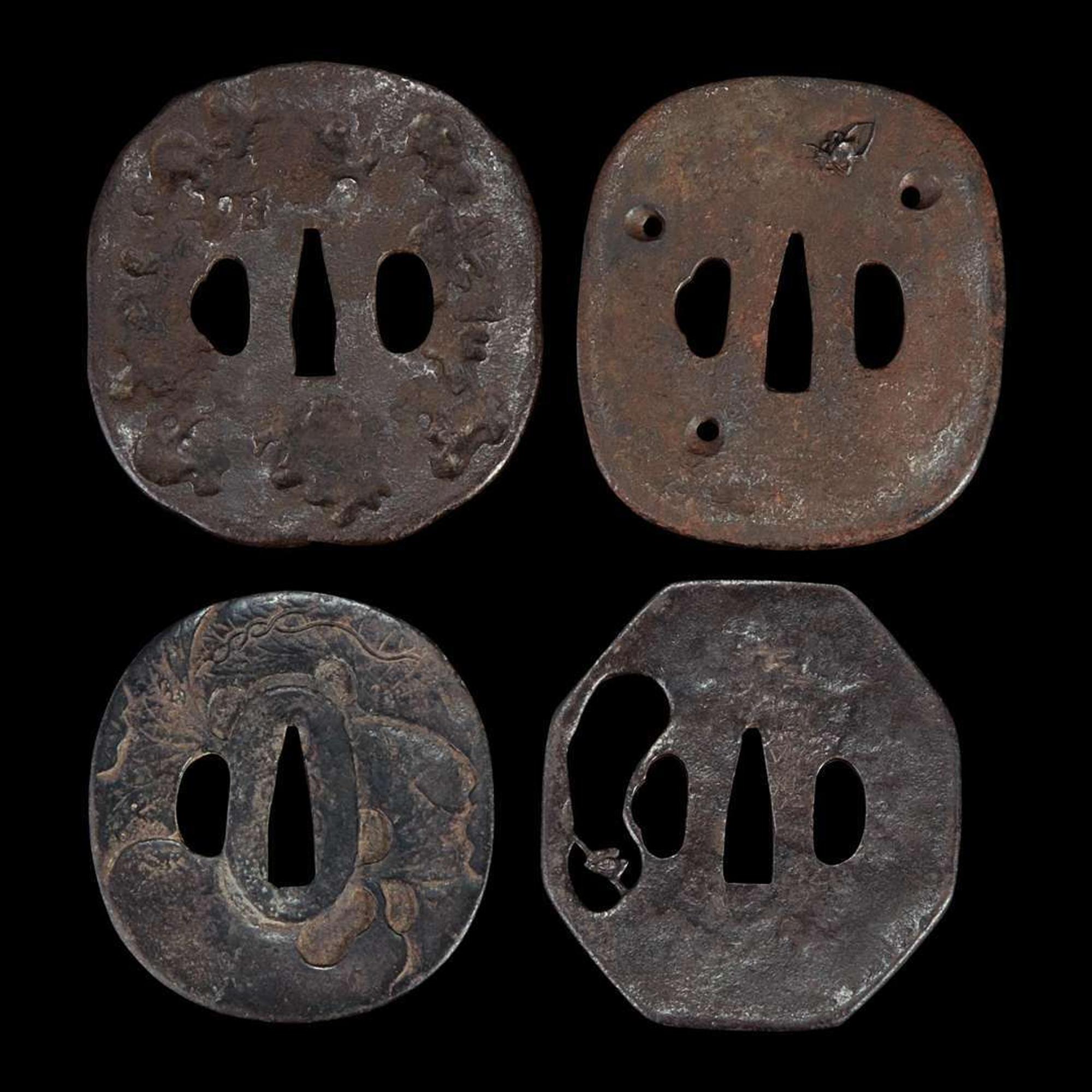 Group of twelve assorted Japanese iron tsuba
