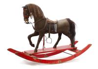A Pair of American Painted Horsehair Applied Rocking Horses, Length 46 inches.