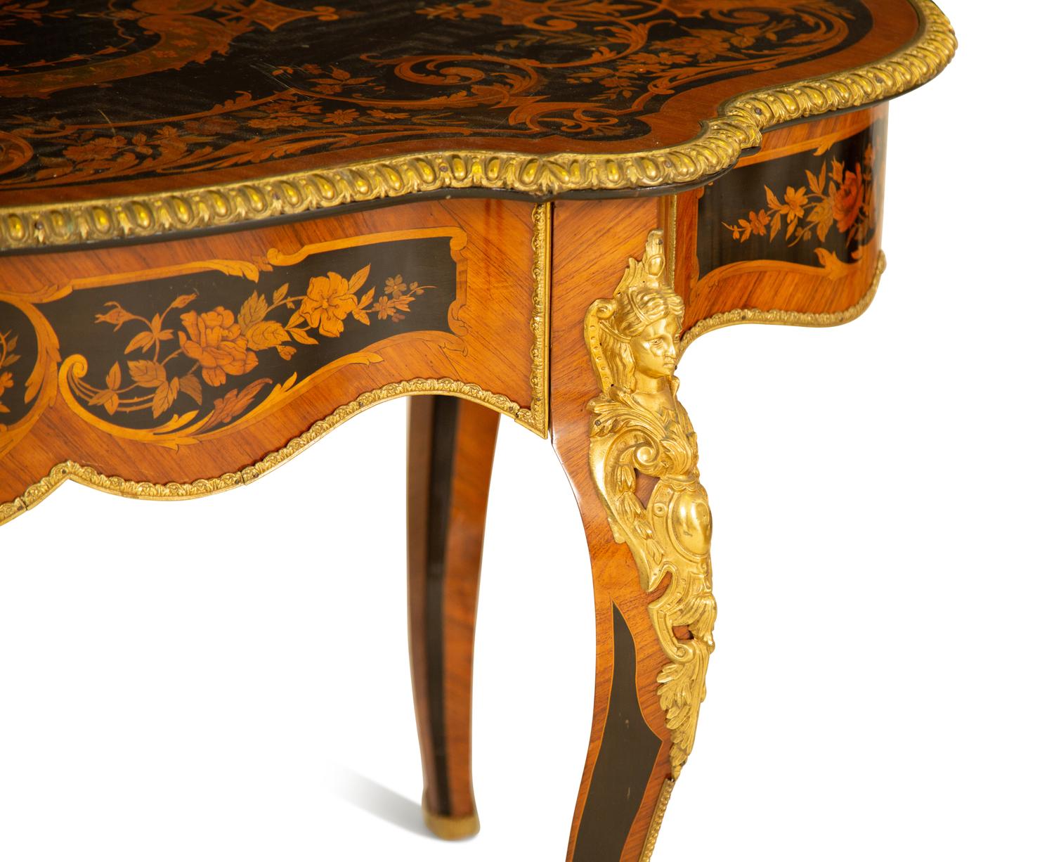 A Napoleon III Style Gilt Bronze Mounted Marquetry Center Table