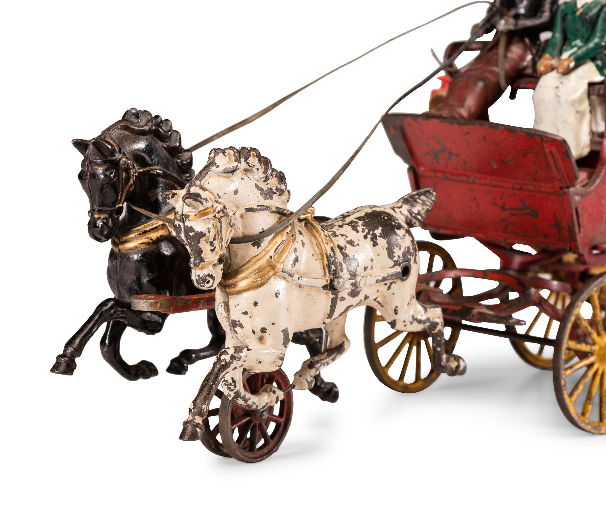 A Hubley Cast Iron Three-Seat Two-Horse Drawn Brake