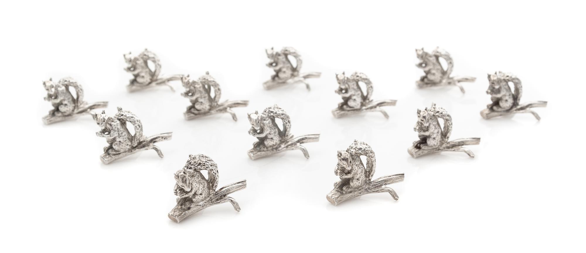 A Set of Twelve American Silver Zoomorphic Placecard Holders, Tiffany & Co., New York, 20th Century, each in the form of a squirrel wit