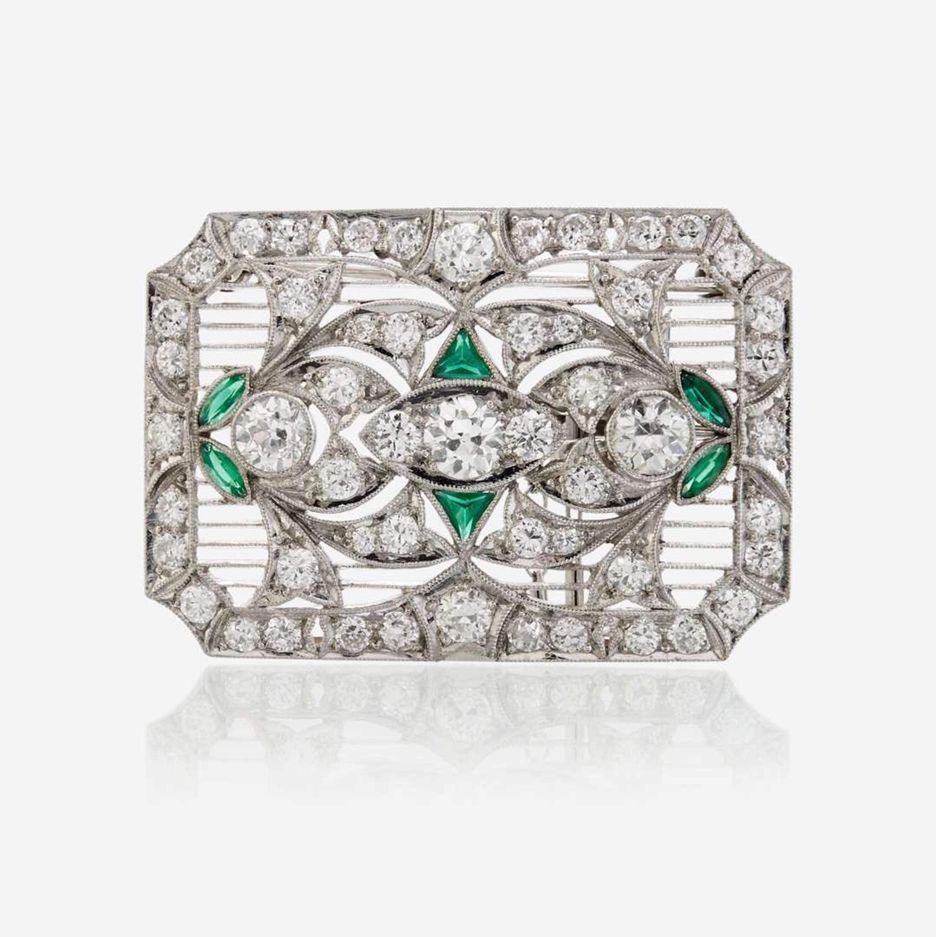 A diamond, glass, and platinum pendant/brooch