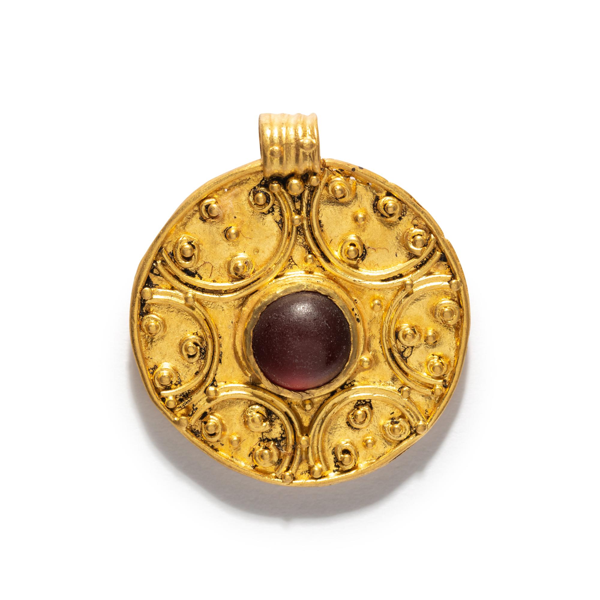A Roman Gold Pendant with a Garnet Cabochon