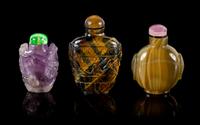 Three Chinese Carved Hardstone Snuff Bottles Height of tallest 3 1/2 inches.