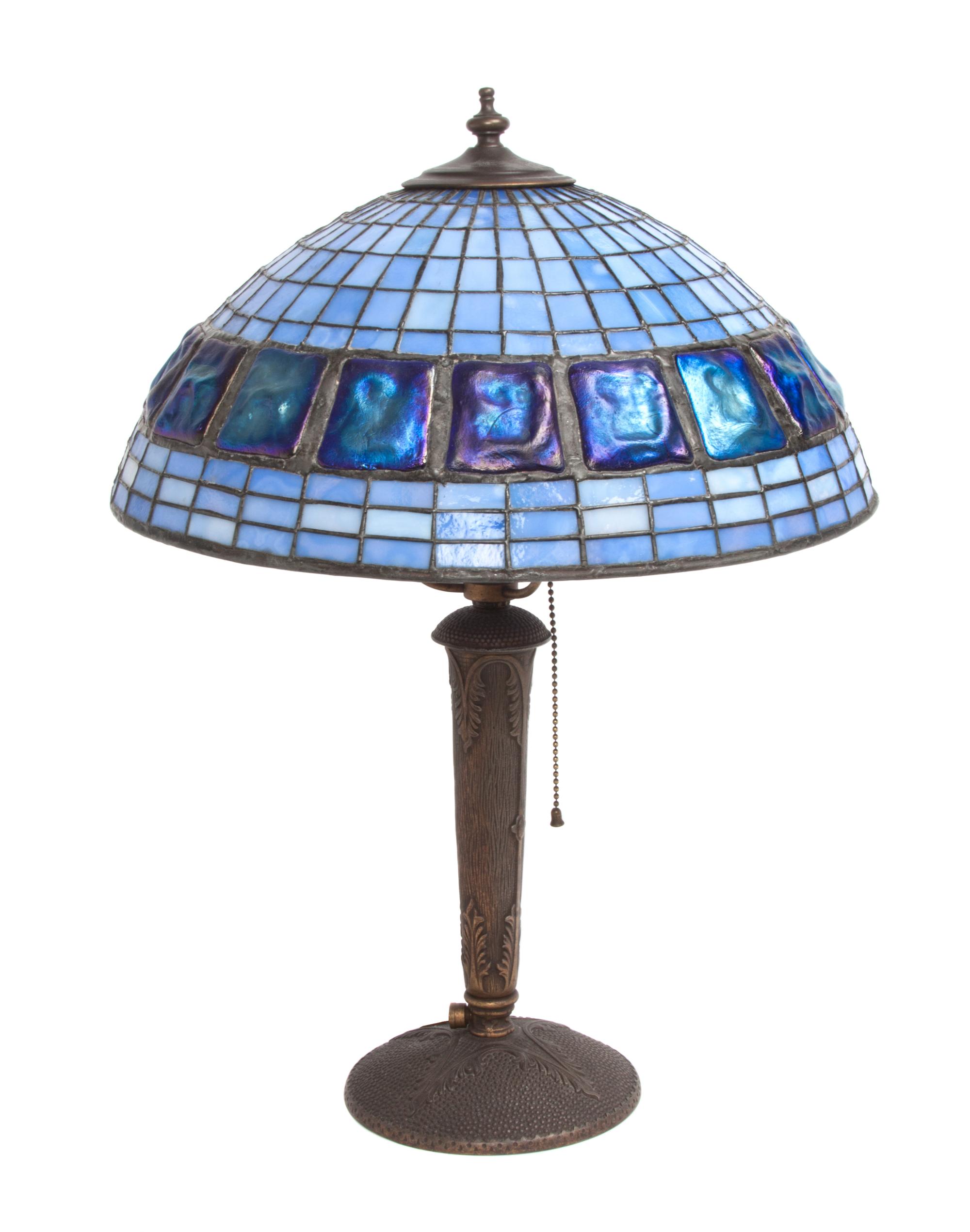 An American Leaded Glass Lamp Diameter of shade 15 x height overall 20 1/2 inches. — 2ND HALF 20TH CENTURY