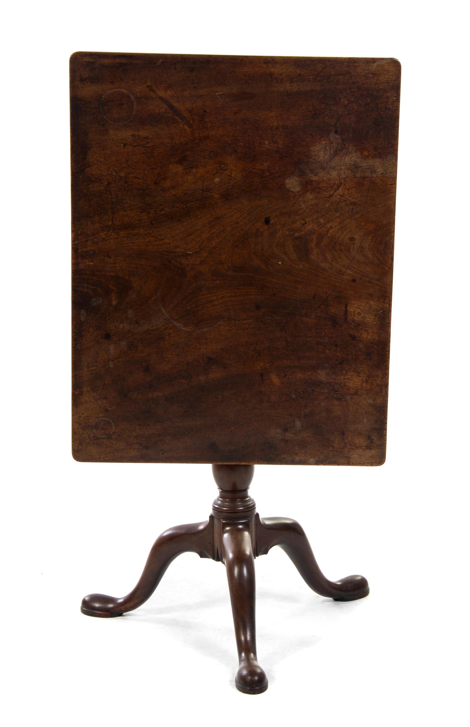 A Queen Anne Walnut Tilt-Top Tea Table, Height 27 x width 29 1/2 x depth 23 inches.
