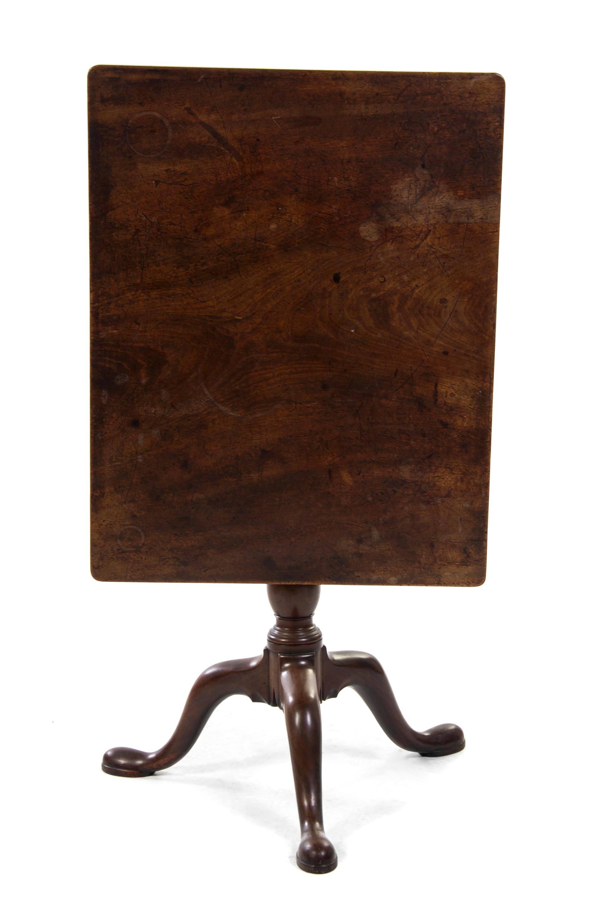 A Queen Anne Walnut Tilt-Top Tea Table, Height 27 x width 29 1/2 x depth 23 inches.