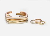 A Collection of Matching Tri-Color Bracelets and Rings