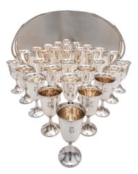 A Collection of Sixteen Sterling Water Goblets, Revere Silversmiths, Brooklyn, NY, each having an engraved script monogram E and raised